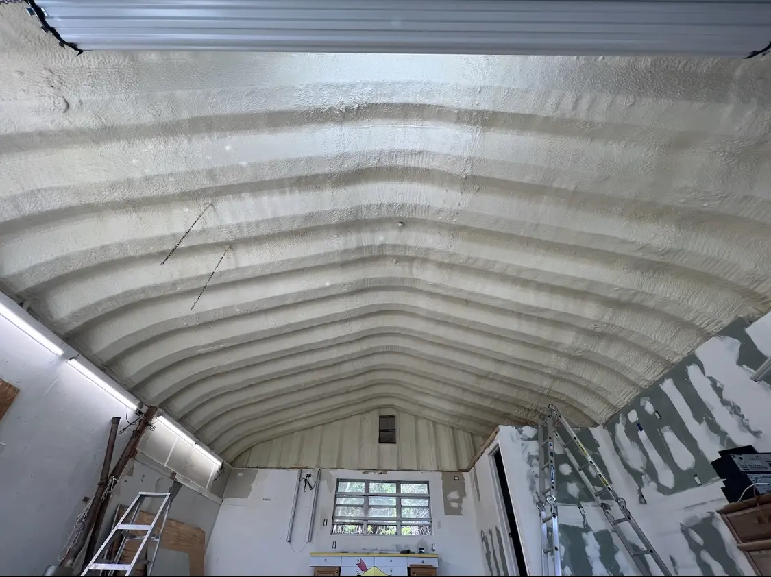 Spray polyurethane foam applied to the underside of a metal roof deck in West Donegal